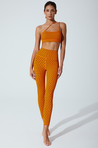 Vibrant orange polka dot women's bra with beetle design, perfect for a stylish look.