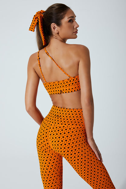Vibrant orange polka dot women's bra with beetle design, perfect for a stylish look.