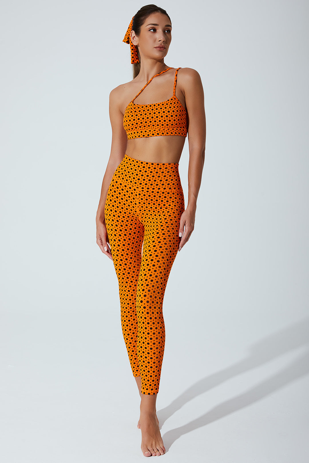 Vibrant orange polka dot leggings for women, featuring a playful beetle design - OW-0023-WLG-OR.