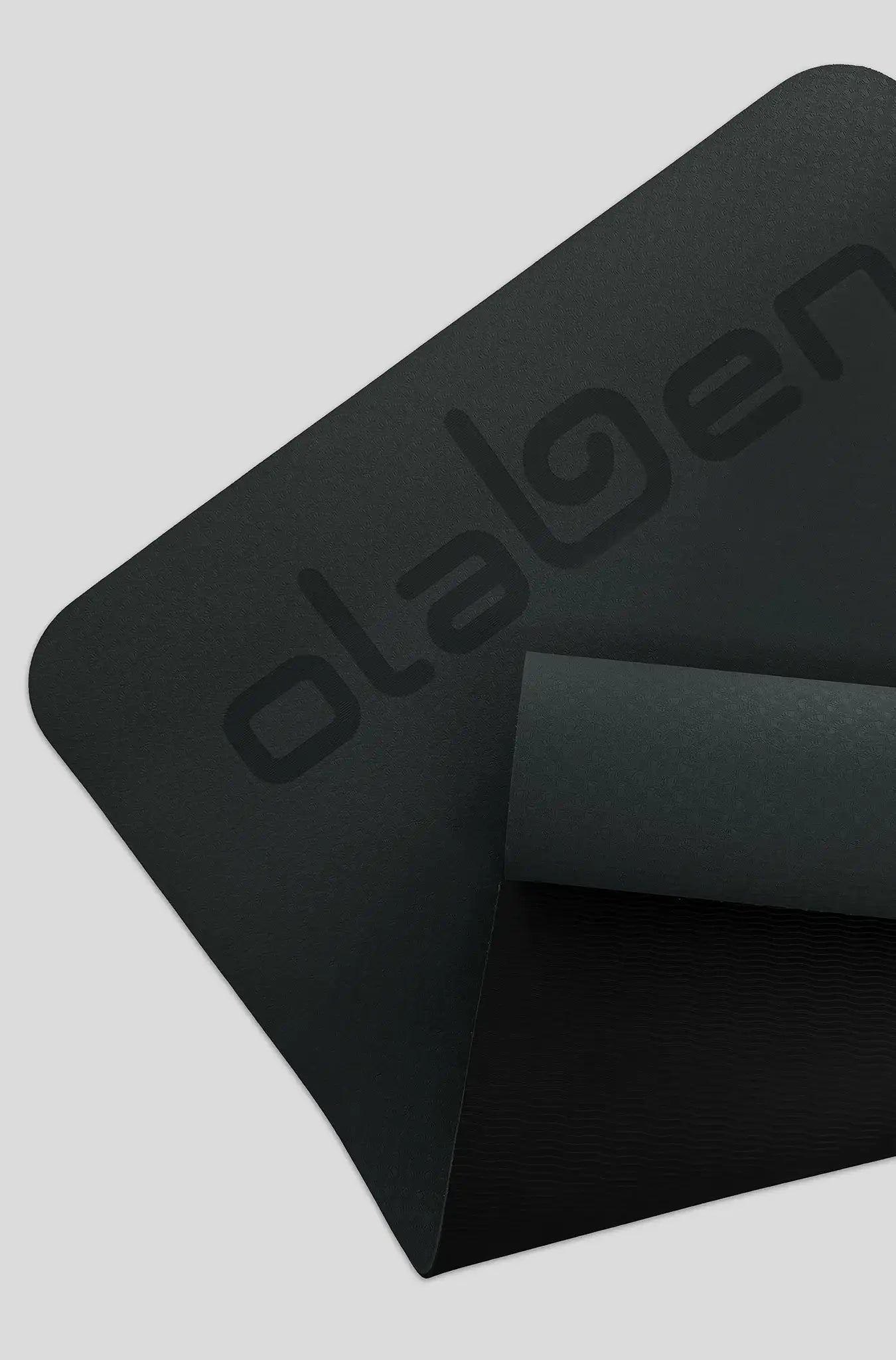 Black Olaben yoga mat with textured grip for fitness and yoga sessions