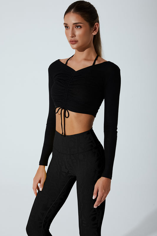 Black drawstring long sleeve women's top with a stylish and comfortable design.