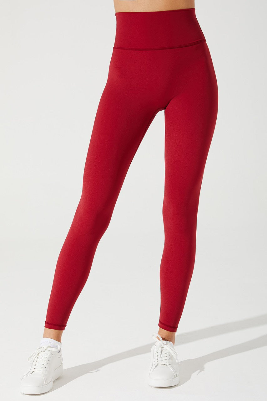 Vibrant magenta red women's leggings by Iyana, perfect for a stylish and energetic look.