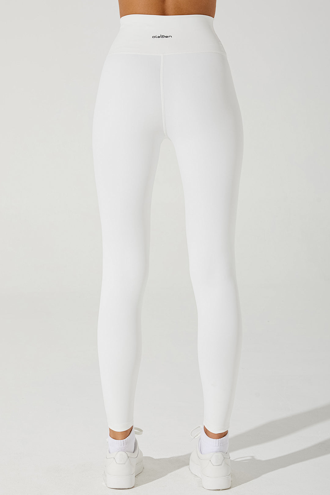 White women's leggings with a stylish design, perfect for any casual or athletic outfit.