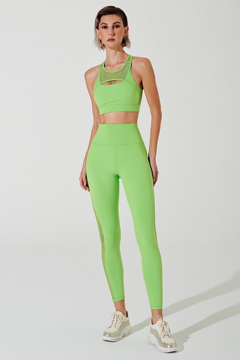 Fluorescent green women's leggings with mesh detailing, perfect for a stylish and vibrant look.