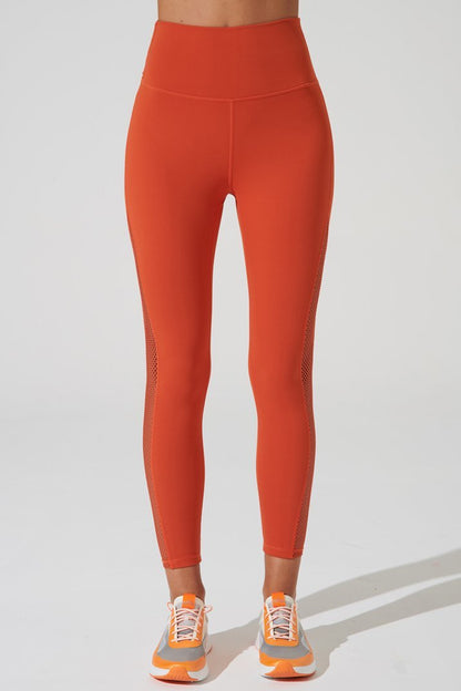 Stylish carmine orange women's leggings with mesh detailing, perfect for medium-sized fashion enthusiasts.
