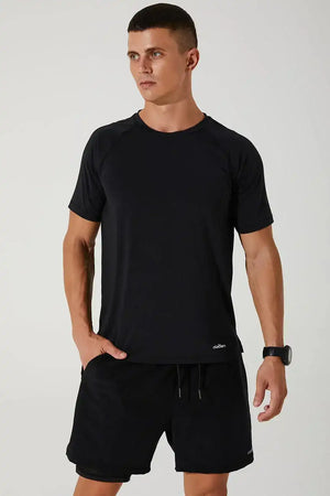 Man modeling black crew neck short sleeve activewear t-shirt and shorts set