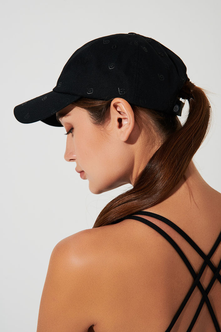 Stylish black monogram headwear with cap design - perfect accessory for a fashionable look.