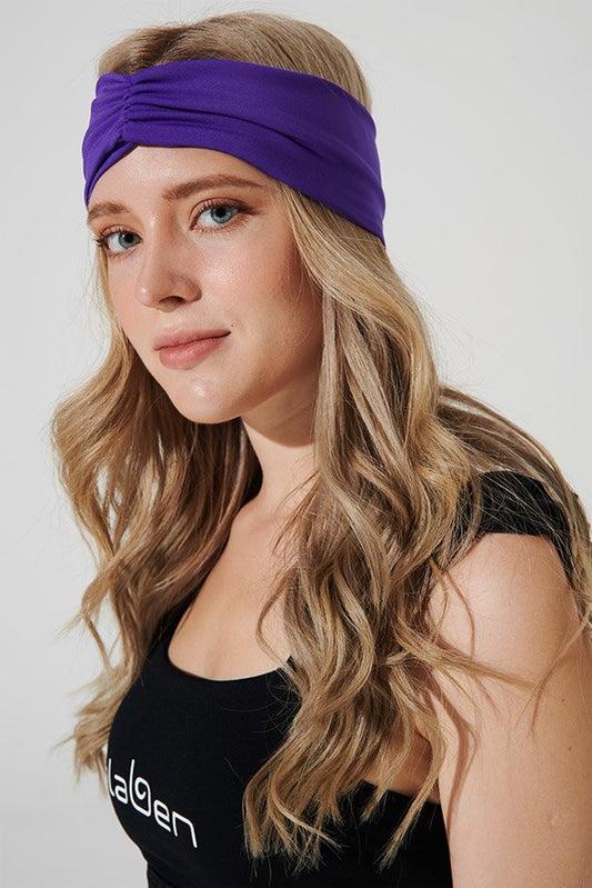 Royal purple headband with OLABEN logo, perfect for adding a pop of color to outfits.