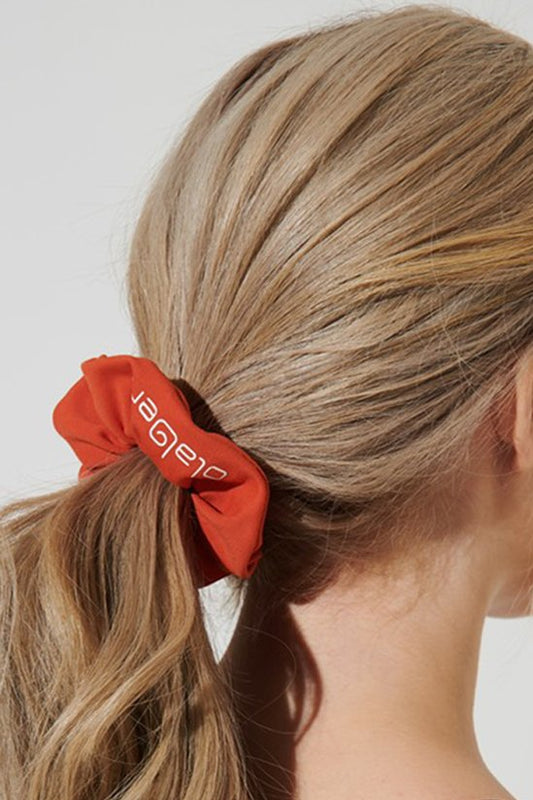 Medium carmine orange scrunchie headwear for women, perfect accessory for a stylish look.