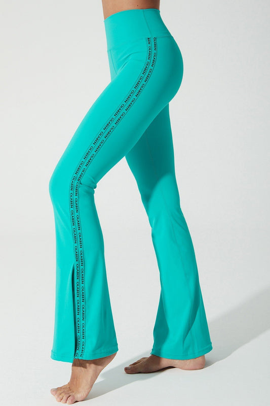 Java green women's leggings with OLABEN YLANG logo, perfect for stylish and comfortable wear.