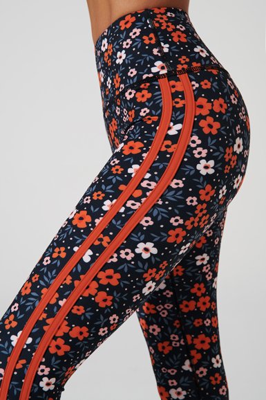 Vibrant orange Maja leggings for women, perfect for a stylish and comfortable workout.
