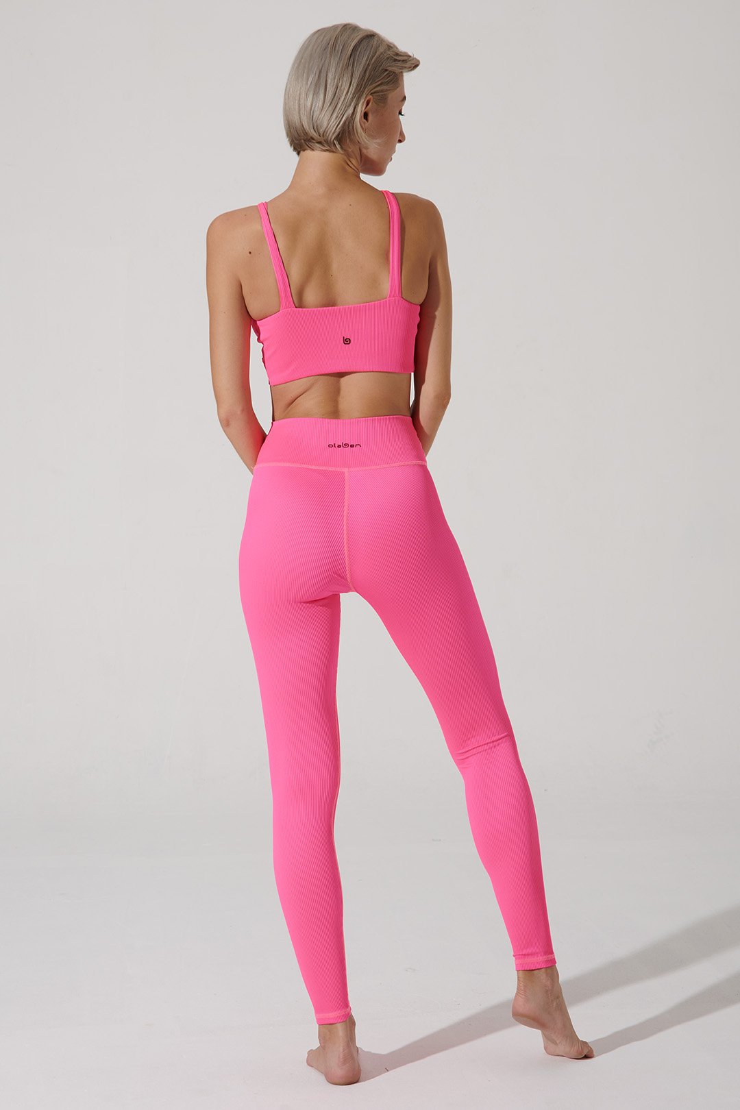 Hot pink high-waist leggings for women, perfect for a stylish and vibrant workout ensemble.