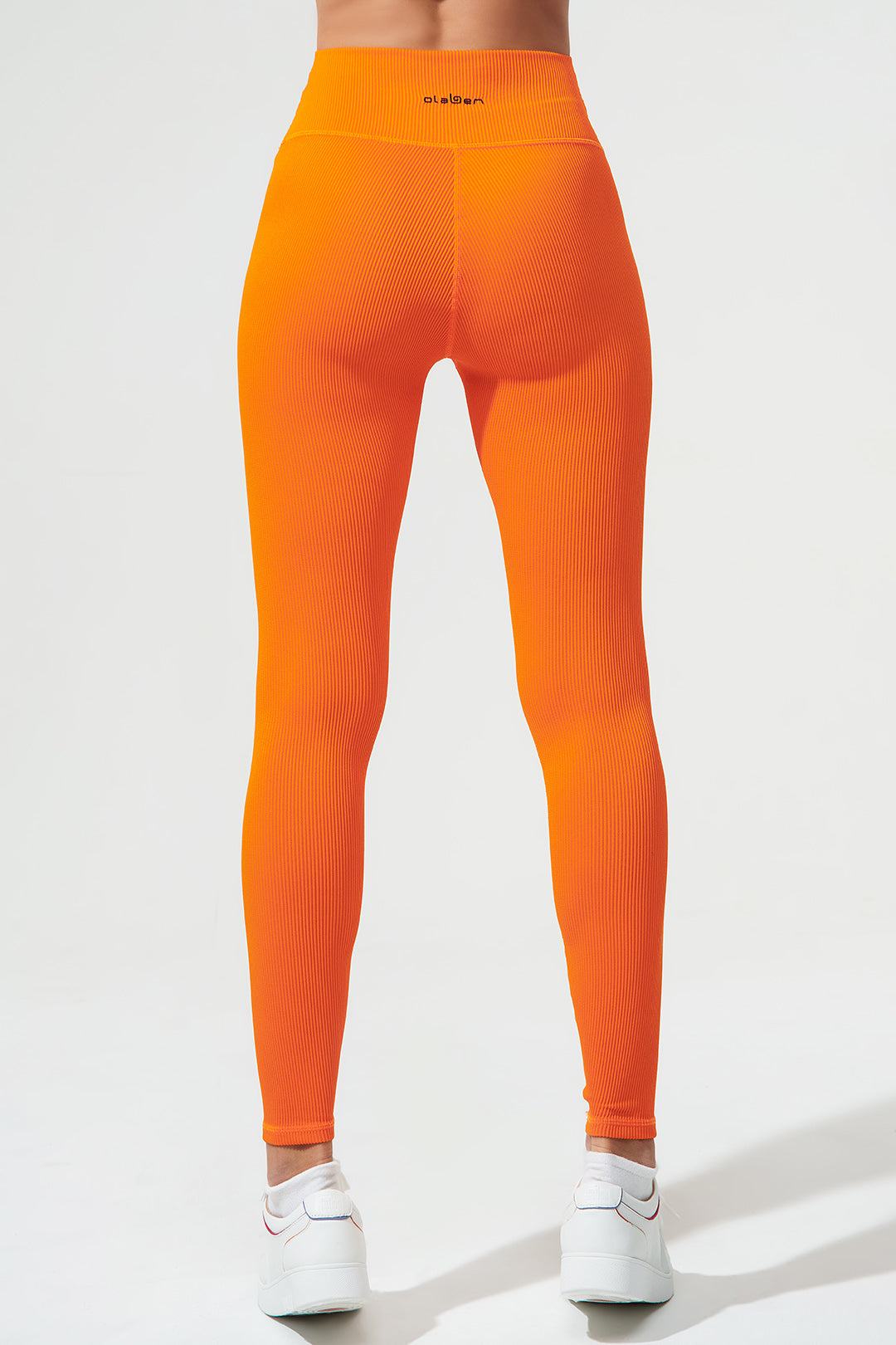 Vibrant tangerine orange high-waist leggings for women, perfect for a stylish and comfortable look.