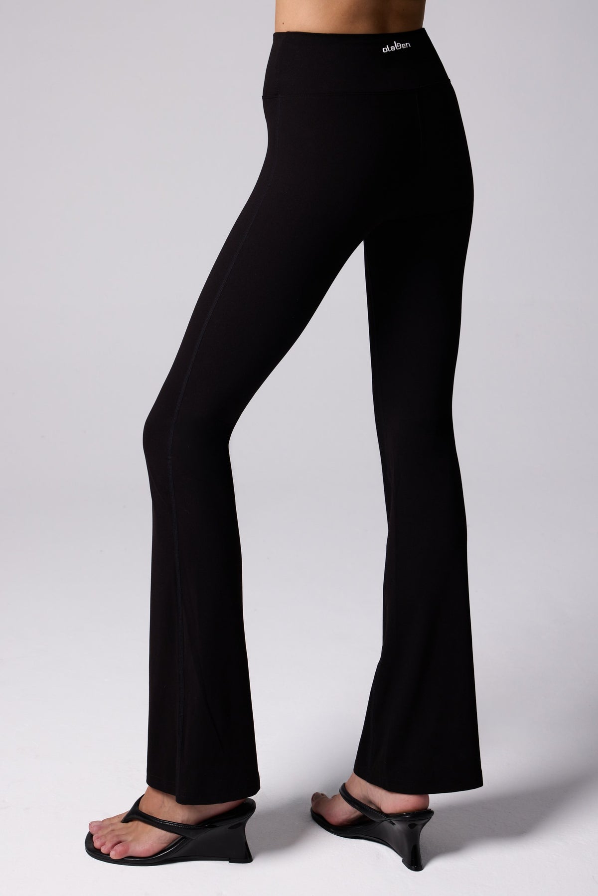 Olaben Romance Flare Leggings in Midnight, back view with logo