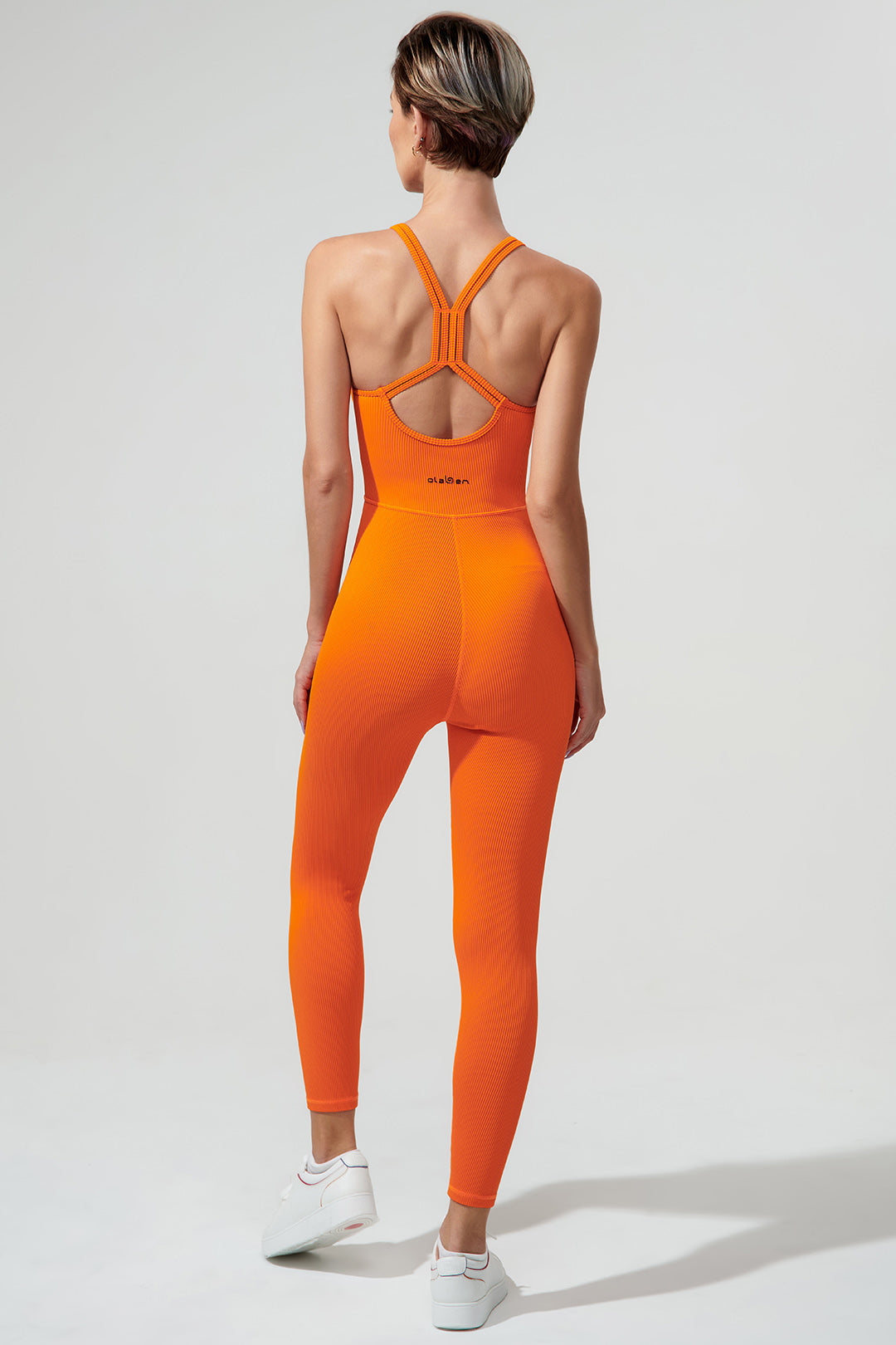 Stylish tangerine orange jumpsuit for women, perfect for a suave and pulpy fashion statement.