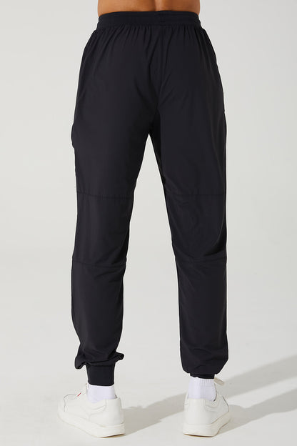 Black men's trousers by Travis Pant, style OW-0029-MTR-BK, in a 3.jpg image format.