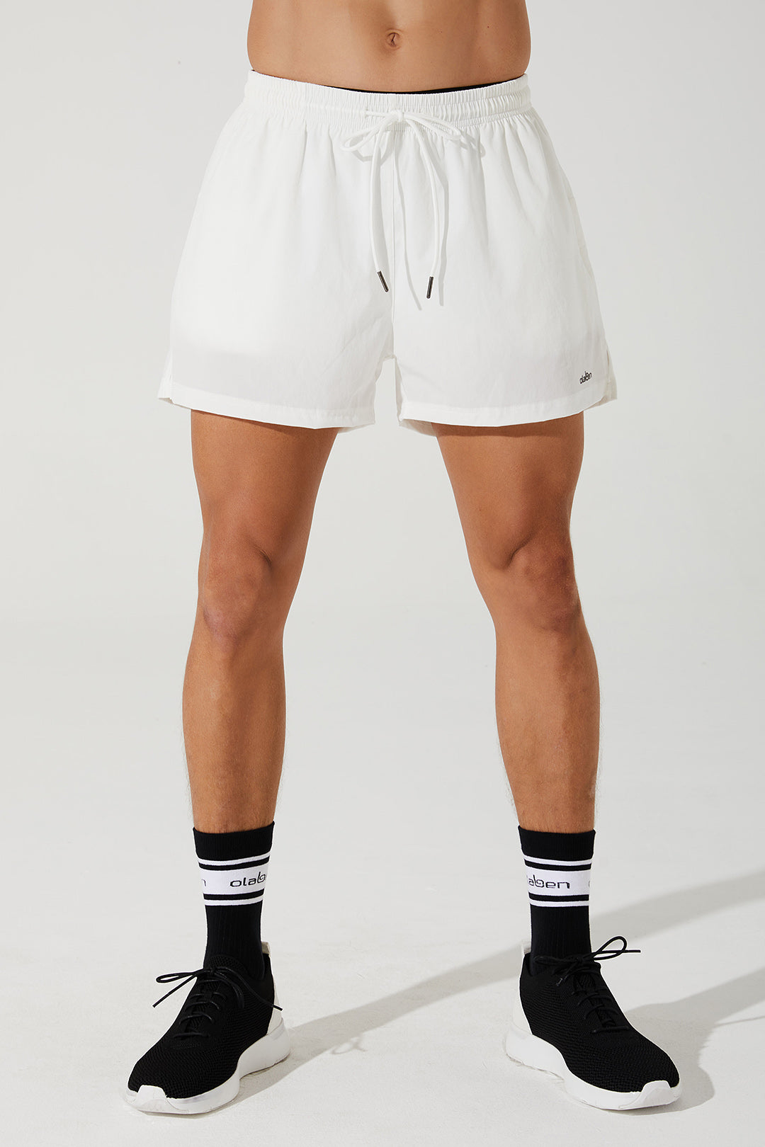 White running shorts for men, perfect for adapting to any workout. (Image: verney_5_adapt_running_short_mens_shorts_white_white_OW-0015-MSH-WT_2.jpg)