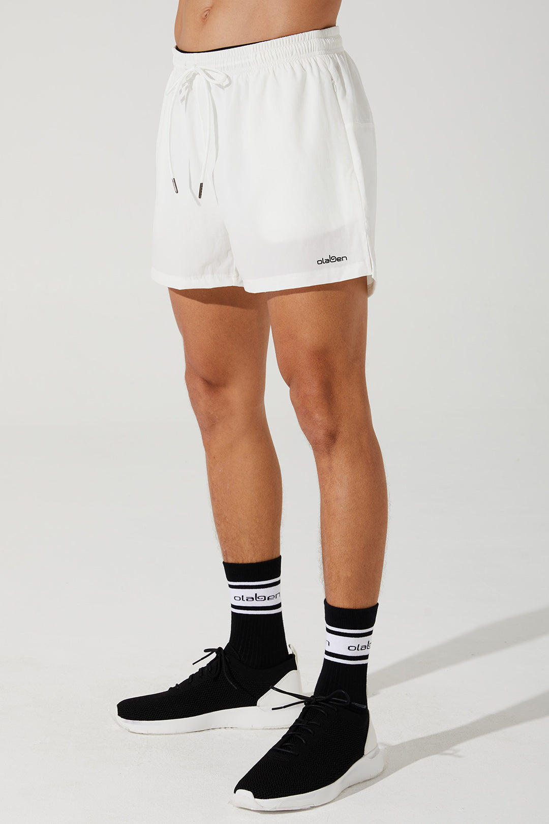 White running shorts for men, perfect for adapting to any workout. (Image: verney_5_adapt_running_short_mens_shorts_white_white_OW-0015-MSH-WT_3.jpg)