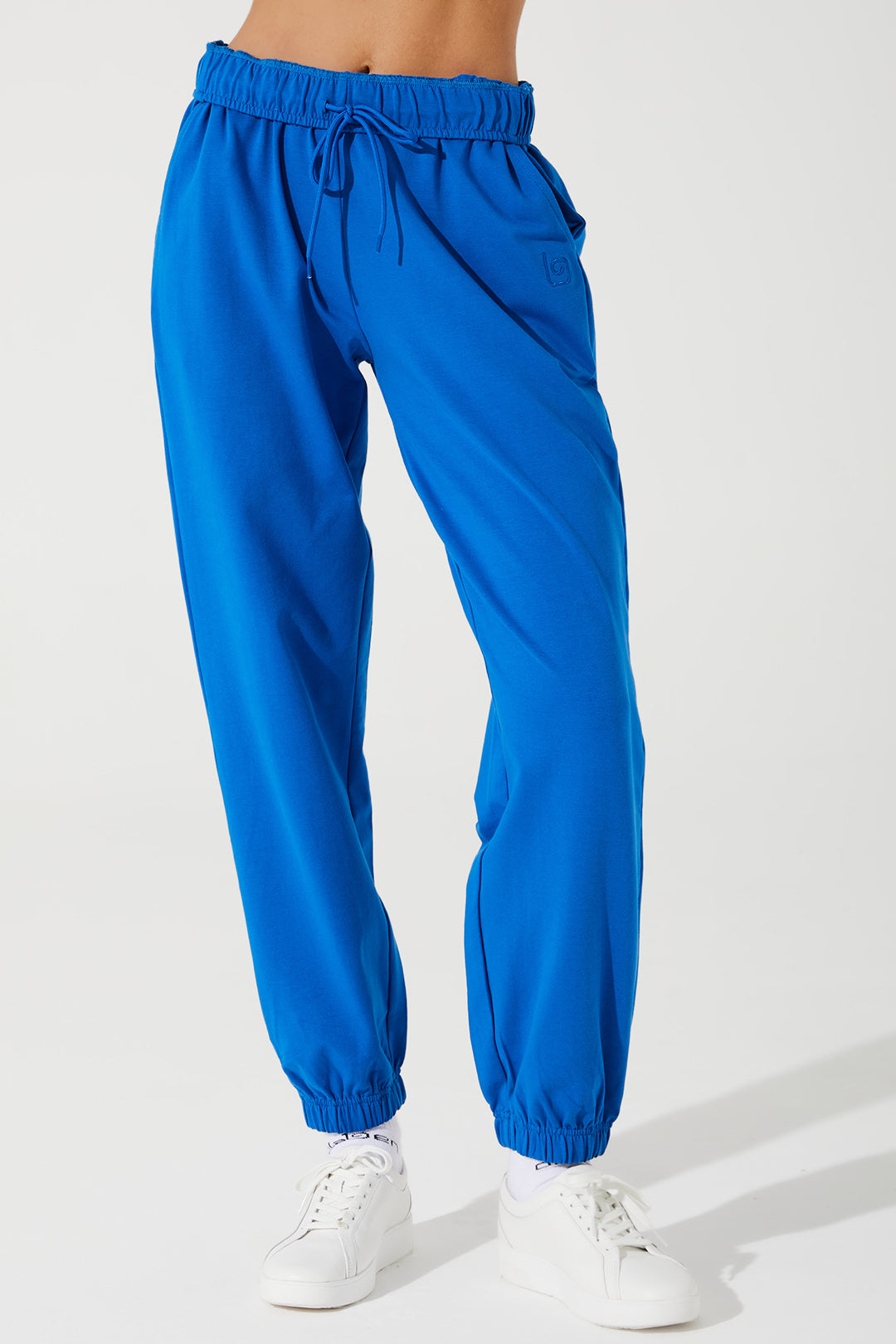 Janet wearing Atlantis Blue sweatpants for women, style OW-0036-WSW-BL, in a woman_janet_sweatpant image.