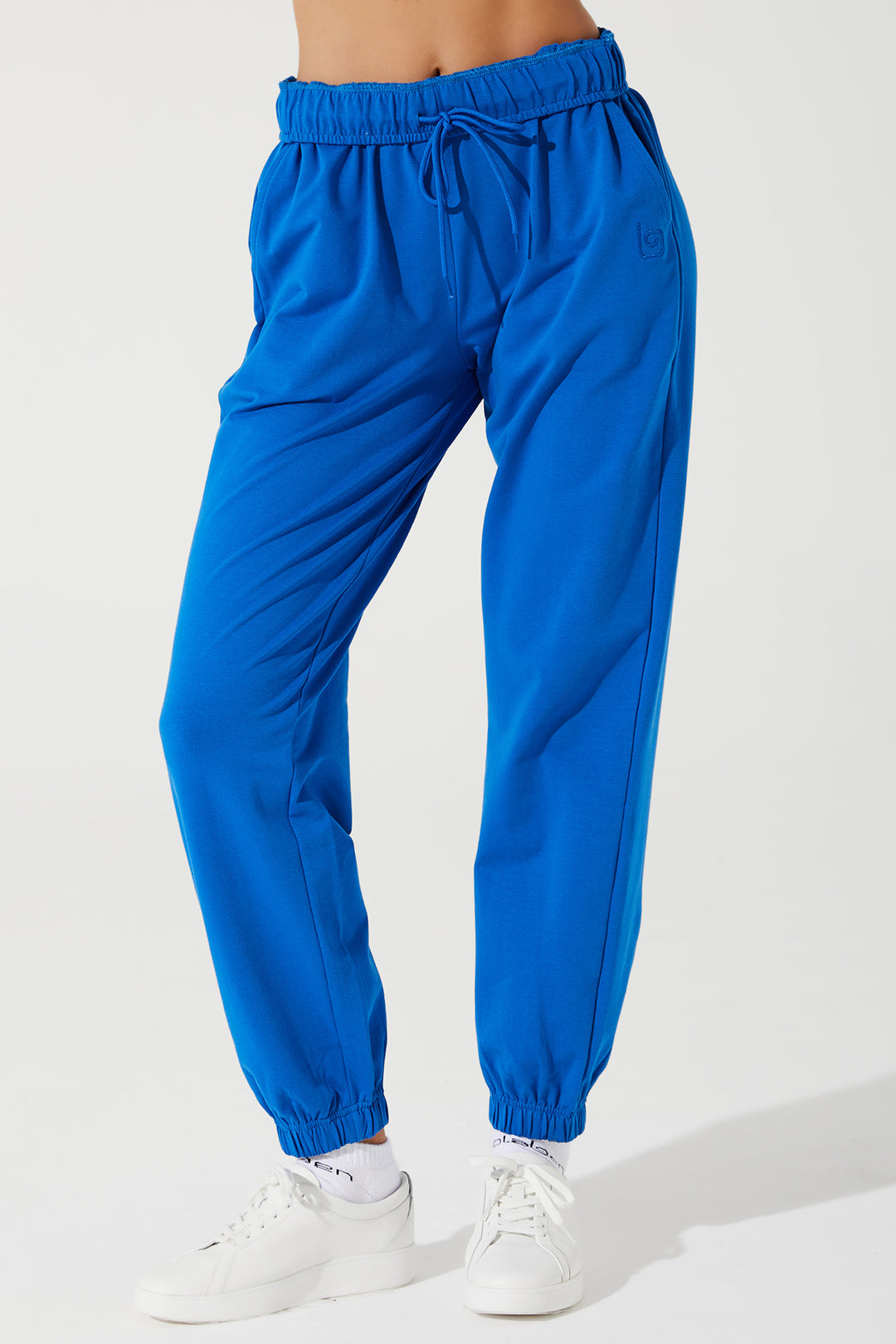 Janet wearing Atlantis Blue sweatpants for women, style OW-0036-WSW-BL, in a 2nd image.