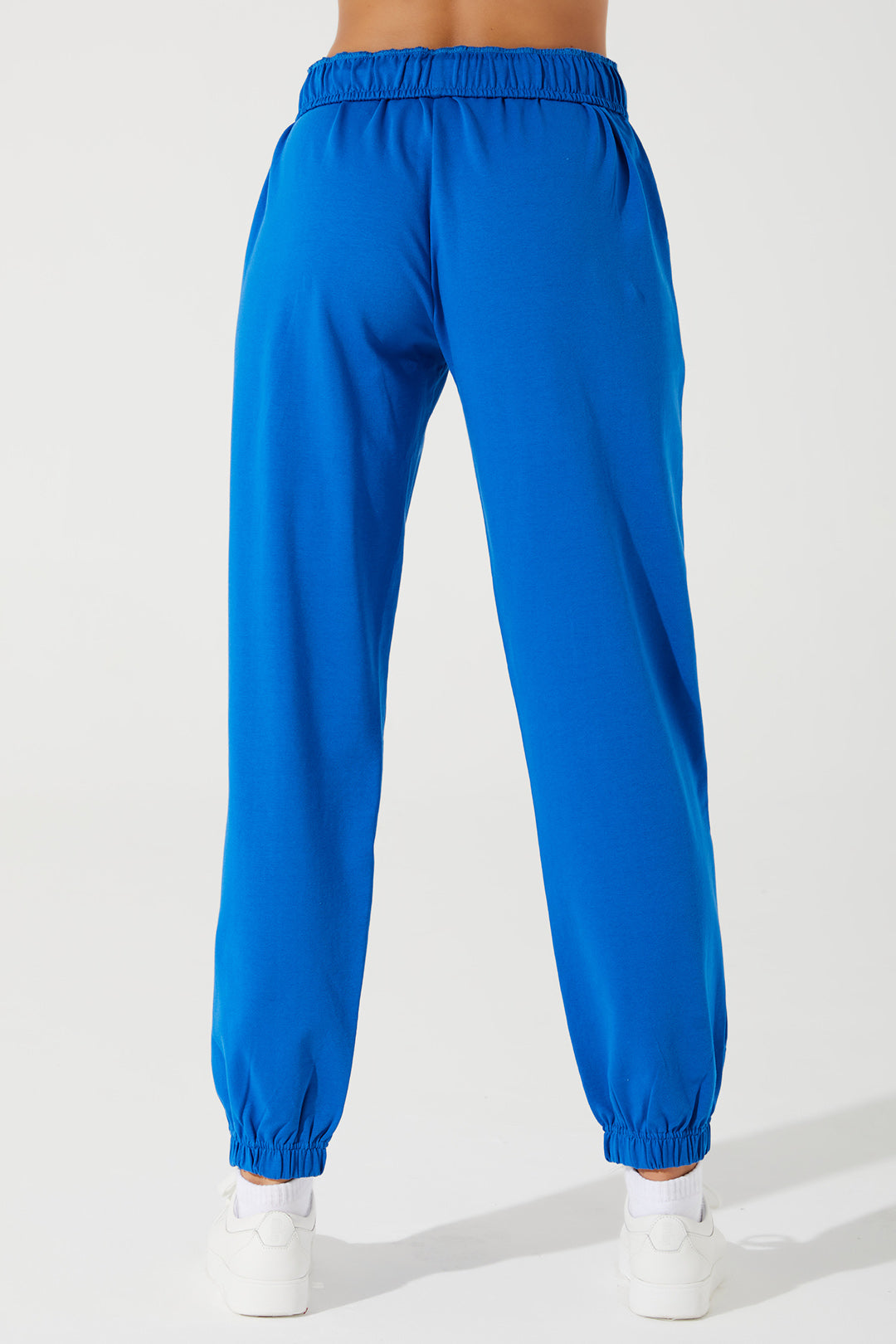 Janet wearing Atlantis Blue sweatpants for women, style OW-0036-WSW-BL, in a 3rd image.