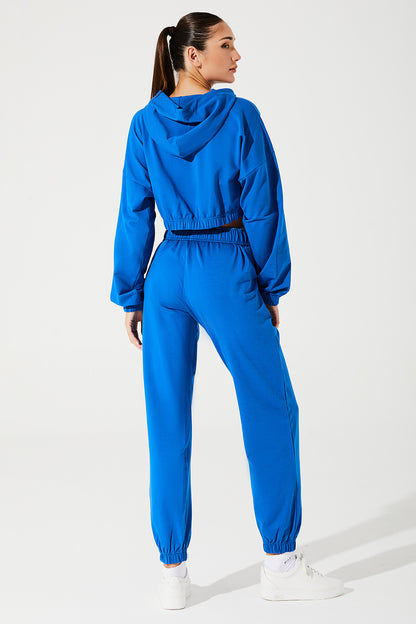 Janet wearing Atlantis Blue sweatpants for women, style OW-0036-WSW-BL, in a 5th size.