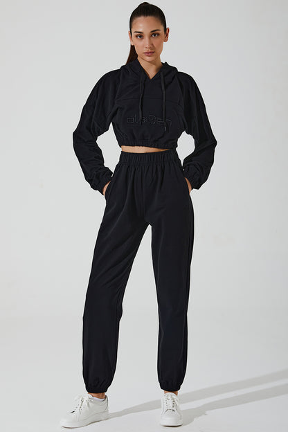 Janet wearing black women's sweatpants, comfortable and stylish, perfect for casual outings or workouts.