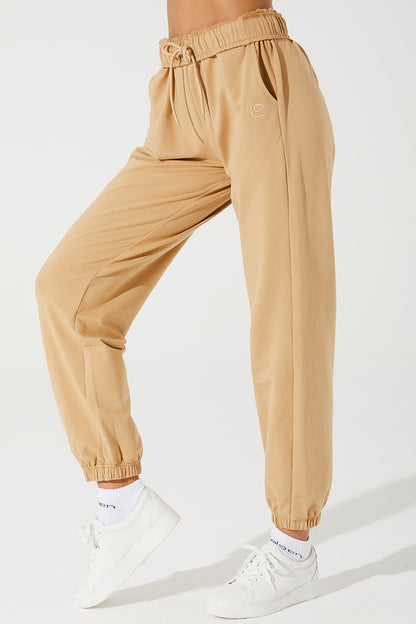 Janet wearing cappuccino beige sweatpants, a comfortable choice for women's casual attire.
