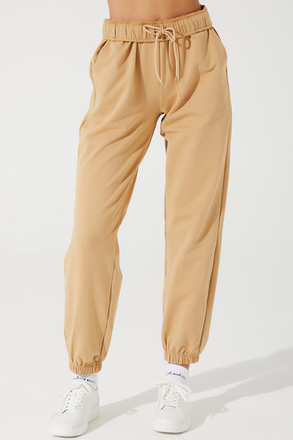 Janet's cappuccino beige sweatpants for women, perfect for a comfortable and stylish look.