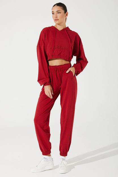 Vibrant magenta red women's sweatpants by Janet, perfect for a comfortable and stylish look.