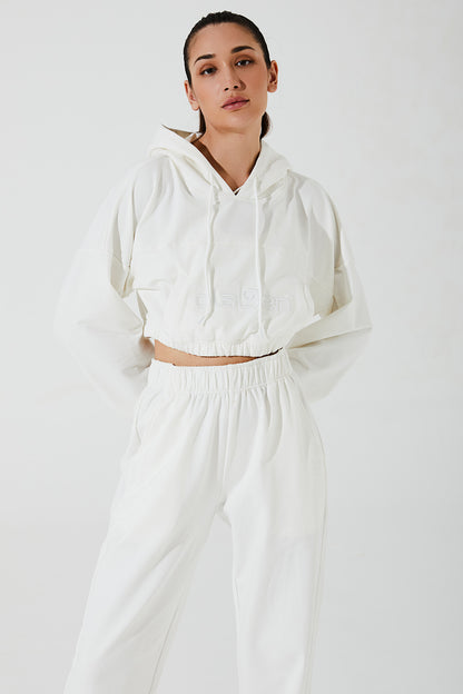Janet wearing white sweatpants for women, comfortable and stylish, OW-0036-WSW-WT, image 2.
